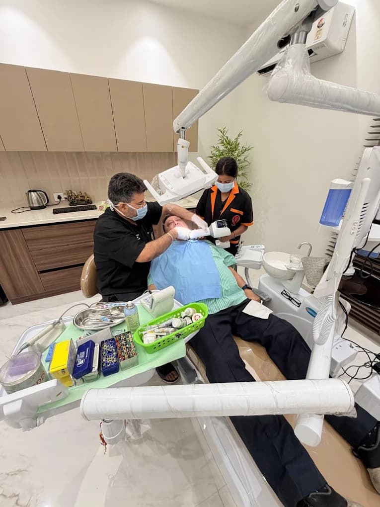 Dr. Shantun Malhotra treating a patient at Smile Architects Multispeciality Dental Care Center, Amritsar